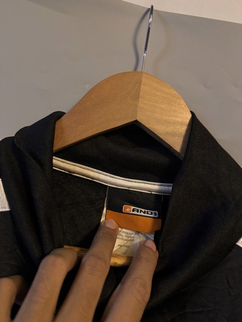AND1 Black Track Jacket With White Stripes (Category: Coats, Jackets and Outerwear) located in Alaminos. Submitted by outfitcheck.ph (Listing ID 1469100303, Image 3). Description: - Brand: AND1 - Color: Black with white side stripes - Design: Full zip front, high collar, dual front pockets - Fit: Ribbed cuffs and hem for a snug fit - Style: Classic athletic sportswear.