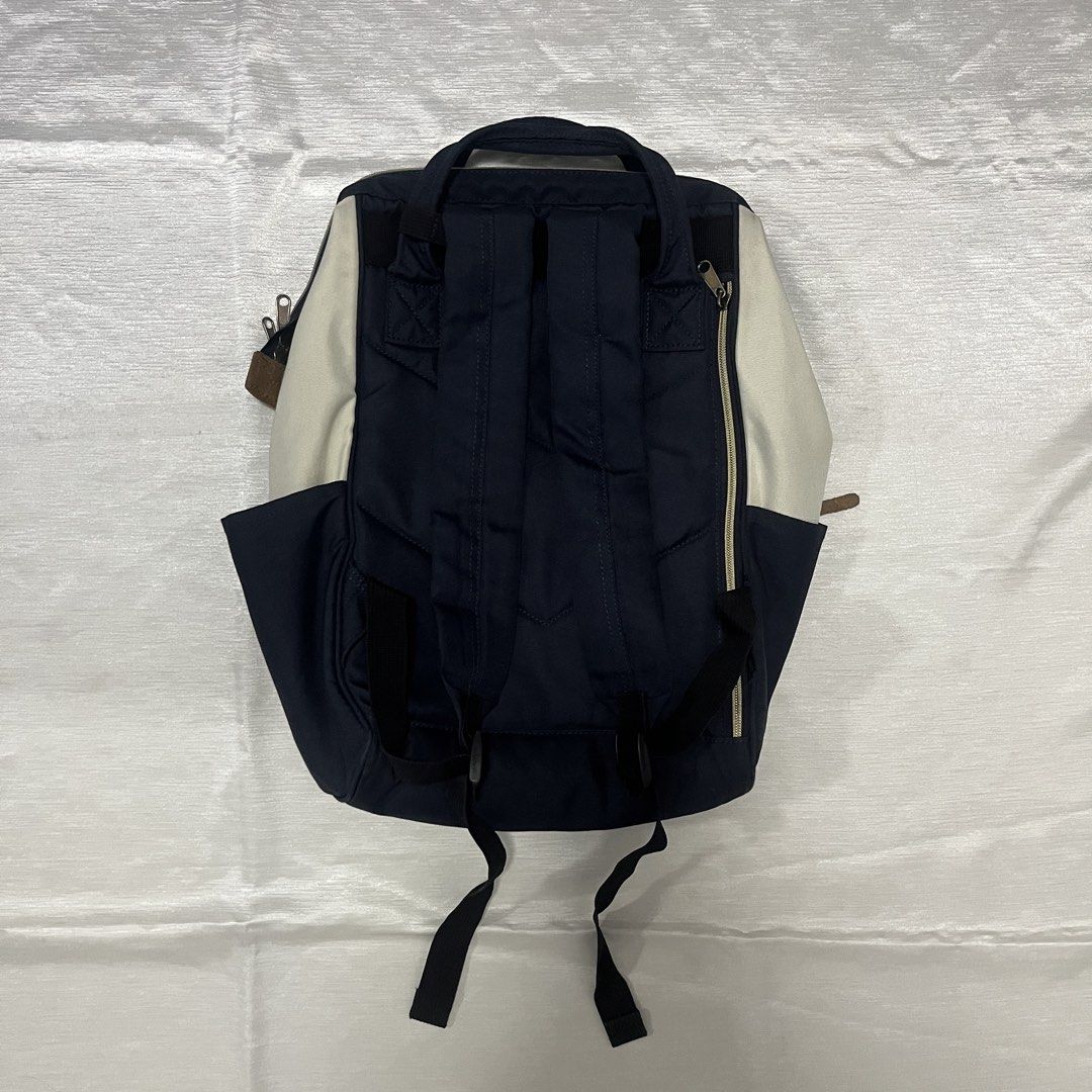 Anello Multi-Color Canvas Backpack (Category: Backpacks) located in Dasmarinas. Submitted by minx203 (Listing ID 1469024600, Image 2). Description: - Brand: Anello - Design: Tri-color (Off-white, Red, Navy Blue) - Material: Sturdy canvas construction - Features: Signature structured frame top opening, front zippered pocket with leather pull tab, double top carry handles, and adjustable padded shoulder straps - Interior: Spacious main compartment 