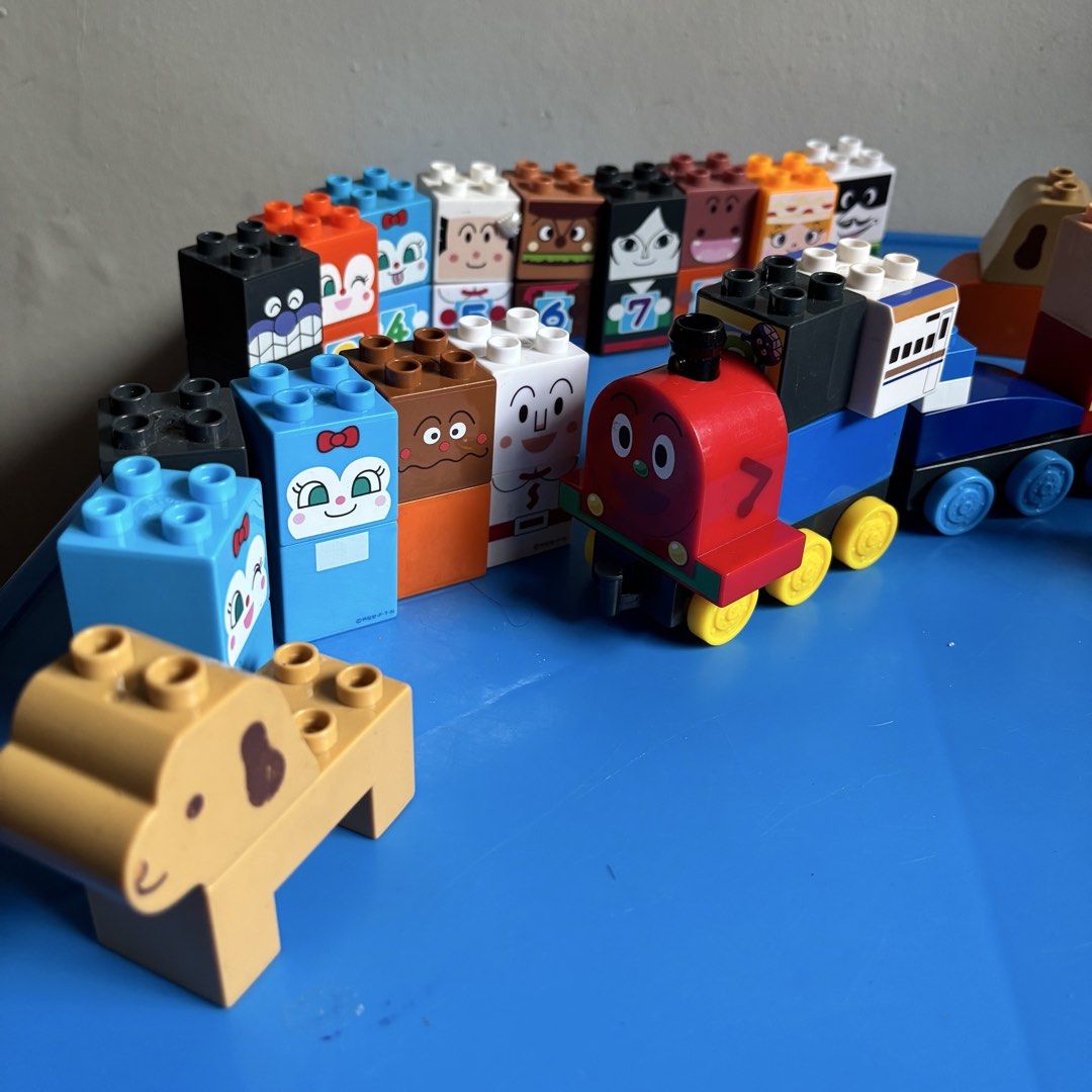 Anpanman block labo train and character sets (Category: Lego & Building Sets) located in Taguig. Submitted by sunnyplaythingsph (Listing ID 1469019547, Image 3). Description: - Authentic Anpanman Block Labo collection for young fans - Includes numbered blocks with cute character faces - Fun roll cake shop sign and push train with working wheels - Features a variety of colorful building bricks, a dog figure, and a cash register block - Great for i
