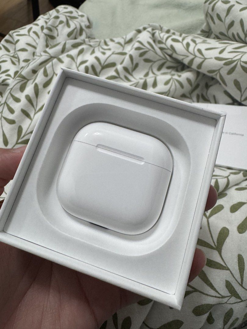 Apple AirPods 4 (Non ANC) (Category: Earphones) located in Manila. Submitted by truecrit (Listing ID 1469104923, Image 3). Description: - Apple AirPods 4 wireless earbuds - Original box included - left airpod has dot or minimal dents (shown in photos) - sound quality and battery is good as new. (item bought in may 2026) - USB-C charging compatible - Clean inside and out.