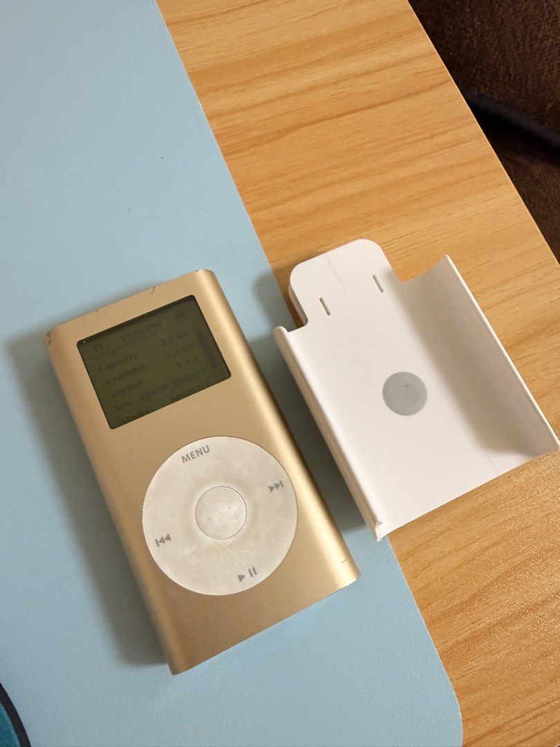Apple iPod mini Gold 4GB (Category: Portable Music Players) located in Manila. Submitted by mochaclosetph (Listing ID 1468961091, Image 1). Description: - Model: Apple iPod mini - Storage Capacity: 4GB - Color: Gold - Condition: Fully functional, turns on and screen displays properly - selling as is long bat life can last upto 2 days or more depending on the usage - Inclusion: White plastic belt clip case and charger cord -location north caloocan