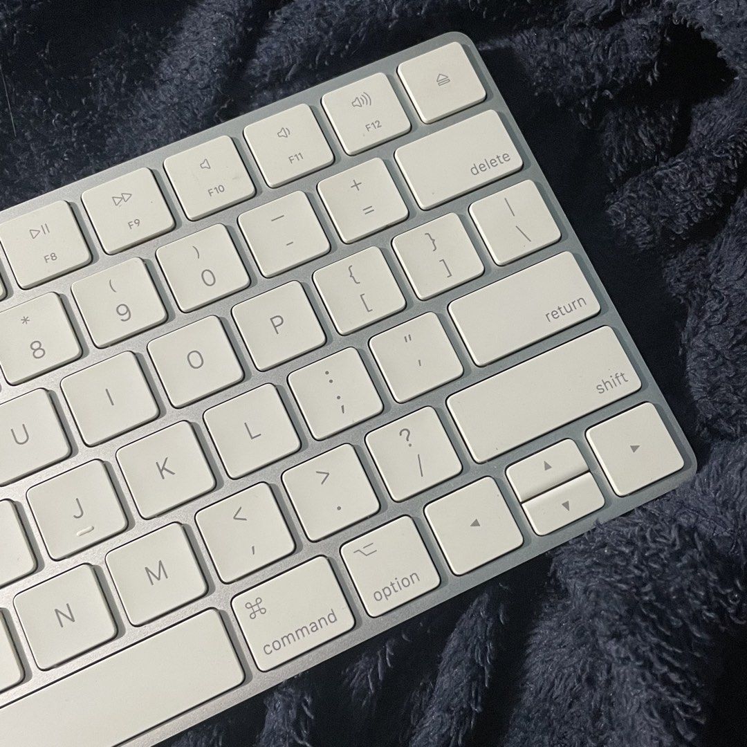 Apple Magic Keyboard (Category: Computer Keyboard) located in Makati City. Submitted by declutterwithann_ (Listing ID 1469023508, Image 3). Description: Apple Magic Keyboard Details: • Model: A1644 • Preloved / used • Keyboard only no lightning cable included • Small stain on the shift button • (1) button has sensor issues sensitive sometimes, video provided for understanding. • Can provide a video showing the keyboard and testing the keys for tr