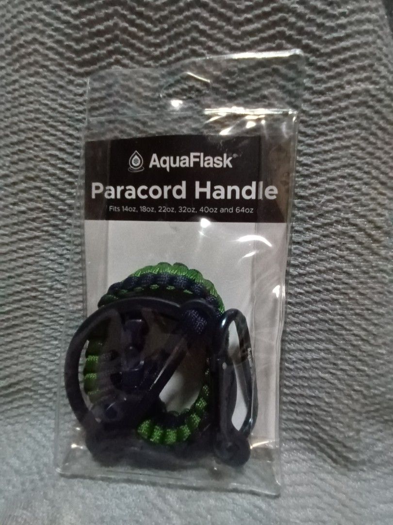 AquaFlask Paracord Handle (Category: Hiking & Camping) located in Makati City. Submitted by chipipaypresyo (Listing ID 1469091781, Image 1). Description: - Color: Navy Blue and Green - Compatibility: Fits 14oz, 18oz, 22oz, 32oz, 40oz, and 64oz AquaFlask bottles - Inclusions: Includes a sturdy carabiner clip - Condition: Brand new, sealed in original plastic packaging with instructions on the back - Feature: Easy to attach and provides a comfortab