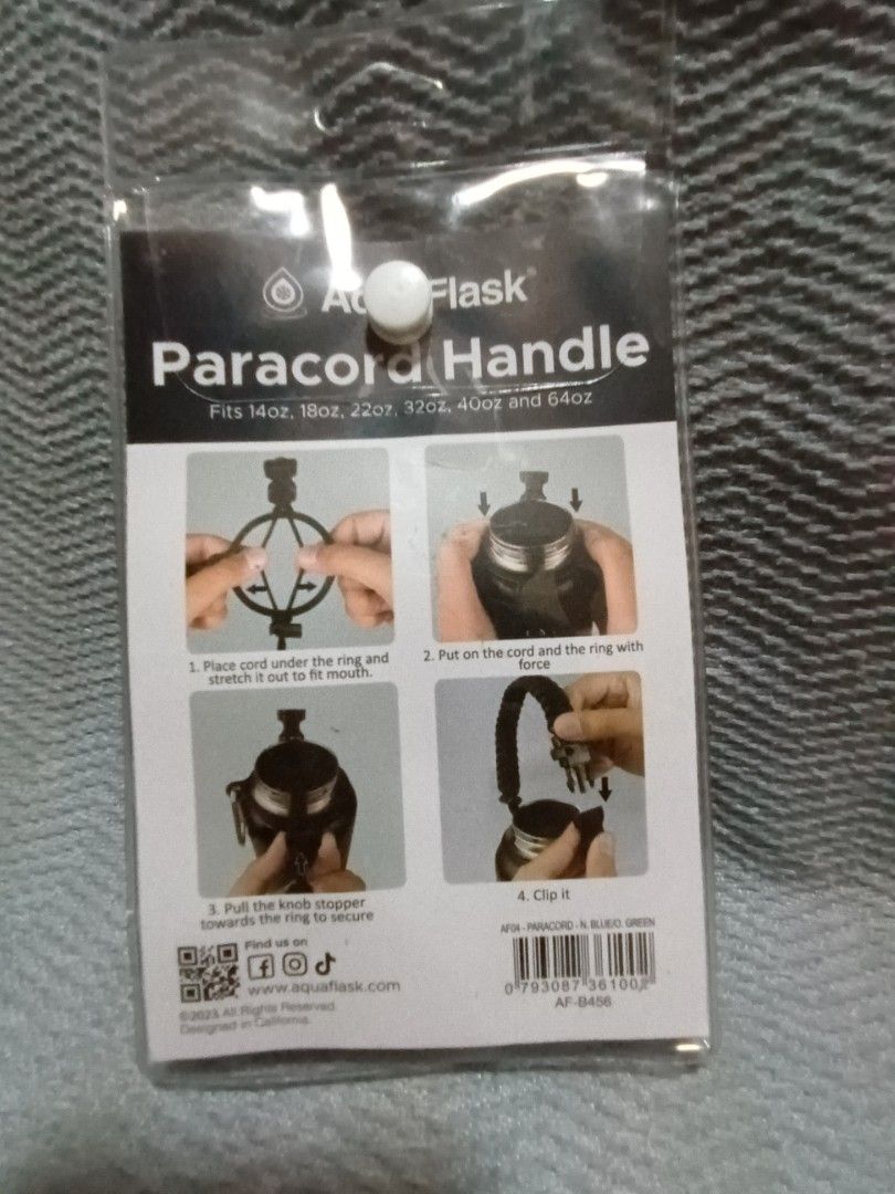 AquaFlask Paracord Handle (Category: Hiking & Camping) located in Makati City. Submitted by chipipaypresyo (Listing ID 1469091781, Image 2). Description: - Color: Navy Blue and Green - Compatibility: Fits 14oz, 18oz, 22oz, 32oz, 40oz, and 64oz AquaFlask bottles - Inclusions: Includes a sturdy carabiner clip - Condition: Brand new, sealed in original plastic packaging with instructions on the back - Feature: Easy to attach and provides a comfortab