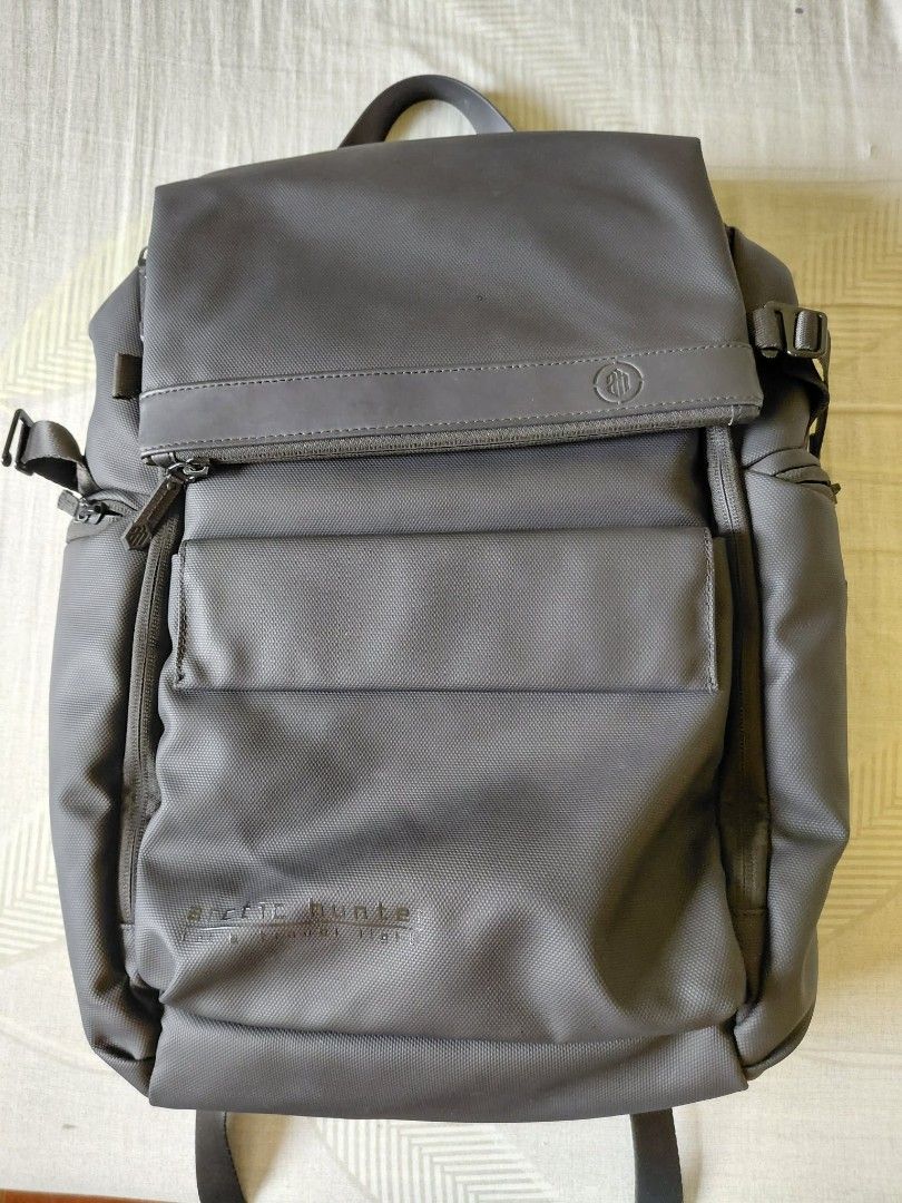 Arctic Hunter Laptop Backpack Black (Category: Backpacks) located in Cavite. Submitted by harveycaraan (Listing ID 1469074236, Image 2). Description: - Brand: Arctic Hunter - Color: Black - Design: Flap top closure with secure strap buckle - Organization: Multiple compartments, dedicated pen slots, phone pocket, mesh section, and key ring attachment - Comfort: Padded mesh shoulder straps and breathable back panel - Material: Durable water-resista