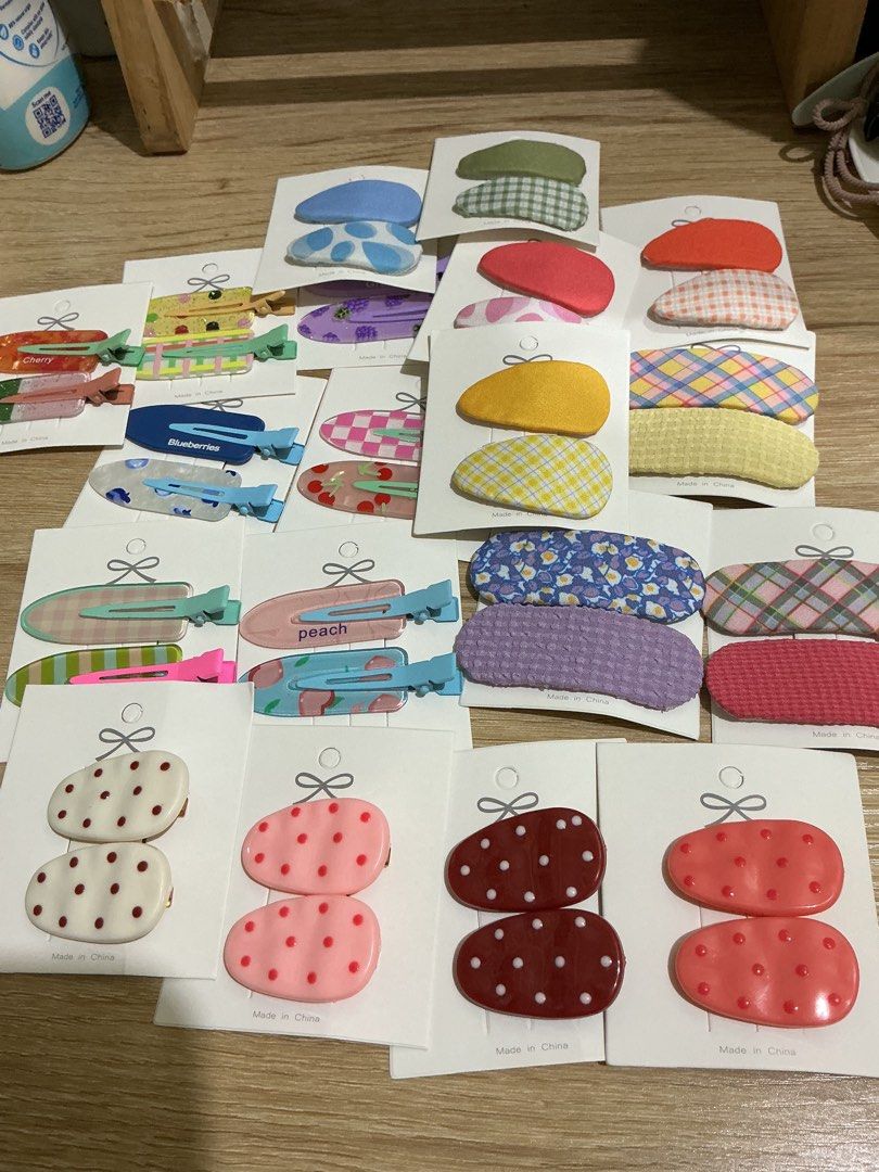 Assorted Cute Hair Clips Set Popsicle and Polka Dot (Category: Hair Accessories) located in Manila. Submitted by jnnnnnnnjnn (Listing ID 1468986546, Image 1). Description: - Large bundle of cute and colorful hair clips - Variety of styles: polka dots, fabric plaid, textured pastel, and fun popsicle designs - Includes vibrant colors like pink, blue, yellow, green, and red - Many clips still on original backing cards with bow details - Great for mi