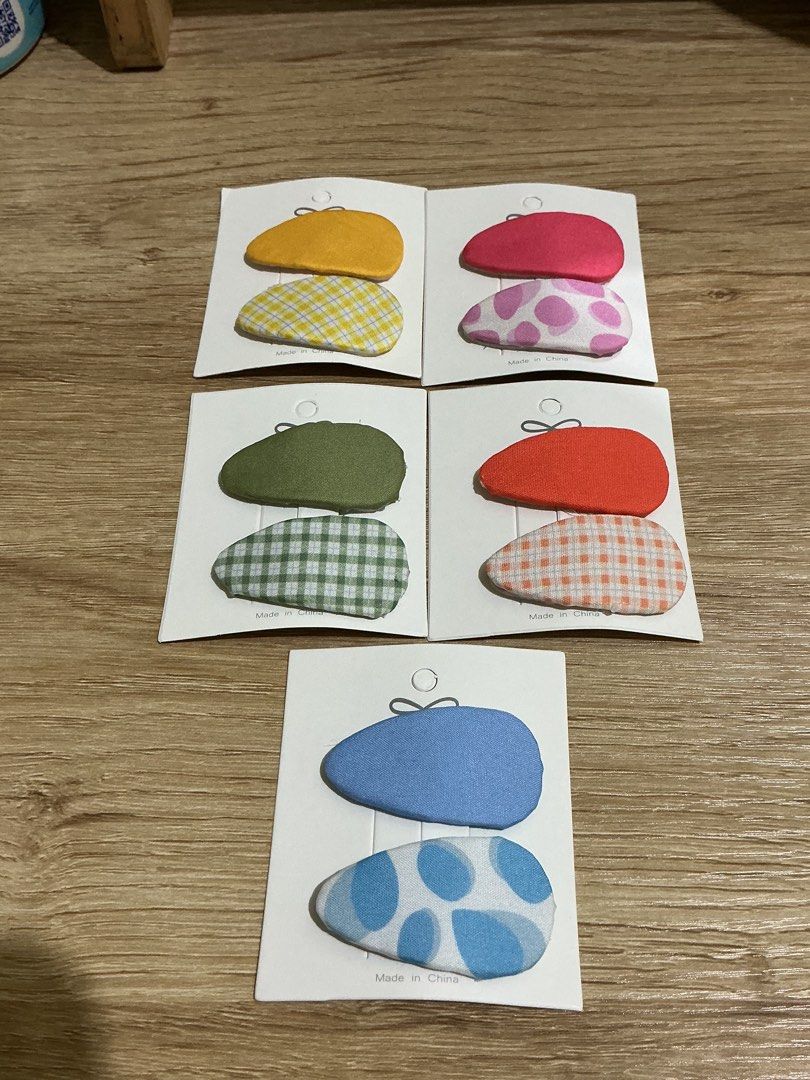Assorted Cute Hair Clips Set Popsicle and Polka Dot (Category: Hair Accessories) located in Manila. Submitted by jnnnnnnnjnn (Listing ID 1468986546, Image 3). Description: - Large bundle of cute and colorful hair clips - Variety of styles: polka dots, fabric plaid, textured pastel, and fun popsicle designs - Includes vibrant colors like pink, blue, yellow, green, and red - Many clips still on original backing cards with bow details - Great for mi
