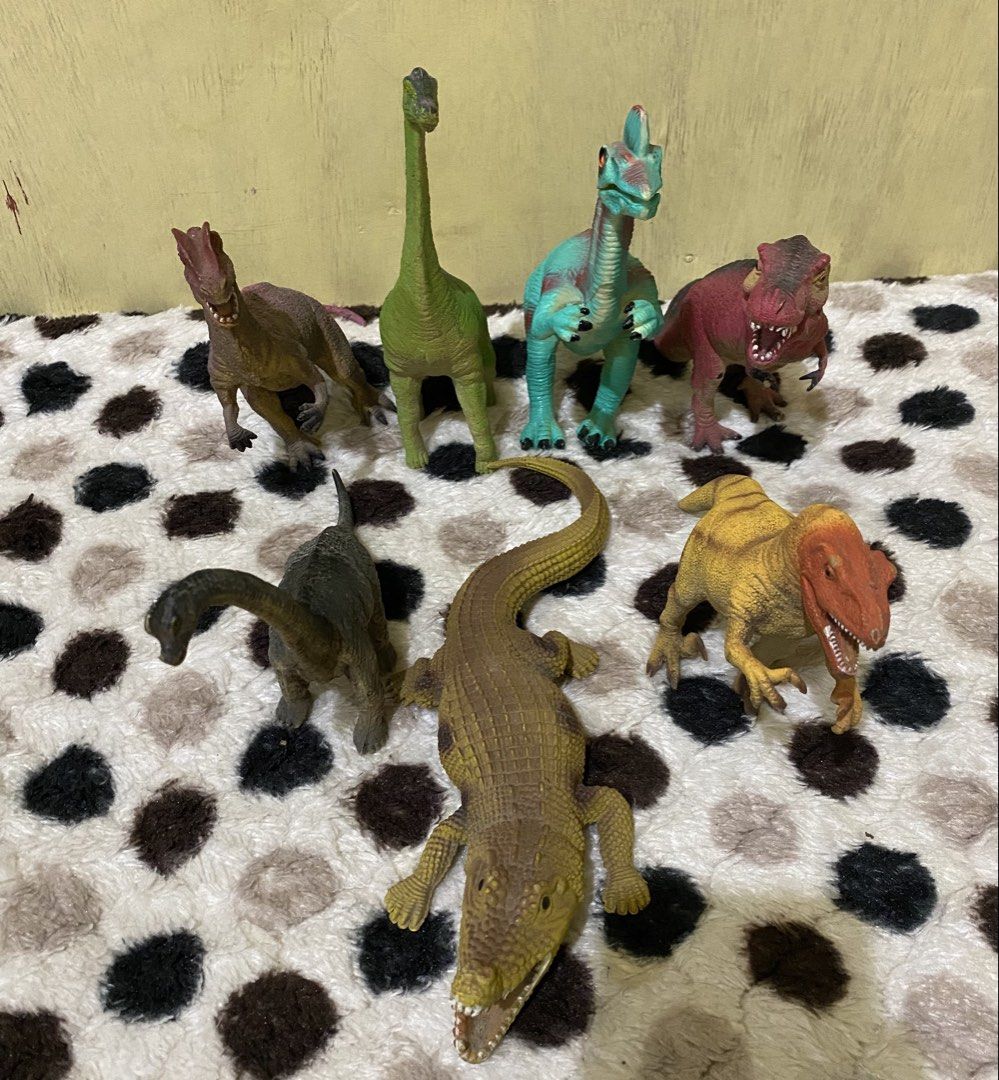 Assorted dinosaur and crocodile toy figures lot (Category: Action & Battle Toys) located in Baguio. Submitted by thrift_bonita (Listing ID 1469030334, Image 2). Description: - Total of 7 vibrant plastic toys - Includes T-Rex, long-necks, and a large open-mouth crocodile - Features bright colors like green, red, teal, and yellow - Great for kids' playtime, imaginative adventures, or room display - Ready for shipping or meetup in the Philippines!.