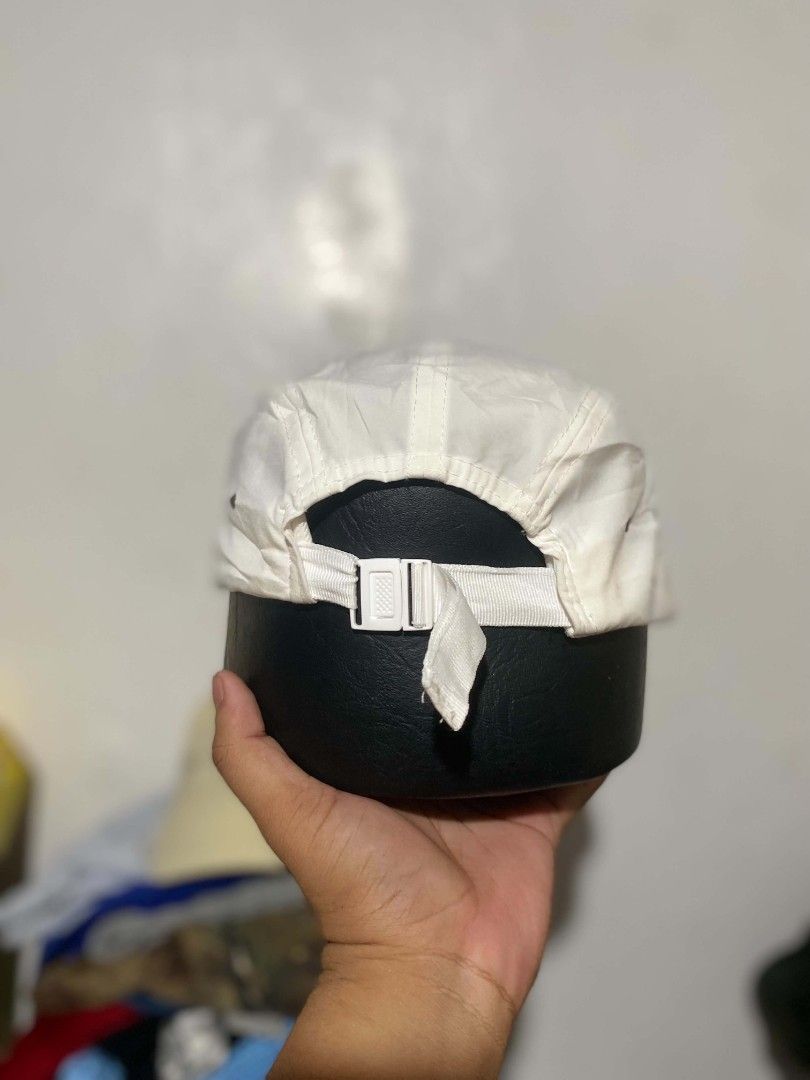 Athletic Works White Five Panel Camp Cap (Category: Caps & Hats) located in Maasin. Submitted by trippythirftyyy (Listing ID 1469103756, Image 2). Description: - Brand: Athletic Works - Style: Five-panel camp cap in solid white - Material: 100% recycled polyester yarn (Made in Bangladesh) - Closure: Adjustable strap with white plastic buckle - Size: One size fits most - Condition: Clean and simple everyday headwear piece.