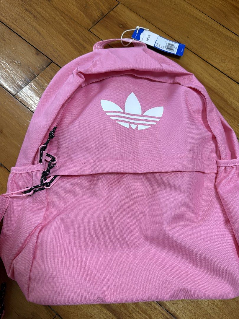 Authentic Adidas BACKPACK WITH PENCIL CASE In Bliss Pink (Category: Backpacks) located in Manila. Submitted by a.c.shop (Listing ID 1468931158, Image 3). Description: Dimensions: 12.25 cm x 30 cm x 42 cm Volume: 18.72 L Main Material: 100% Polyester(100% Recycled) / Lining: 100% Polyester(100% Recycled) / Padding: 100% Polyethylene Zip closure Colour: Bliss Pink .