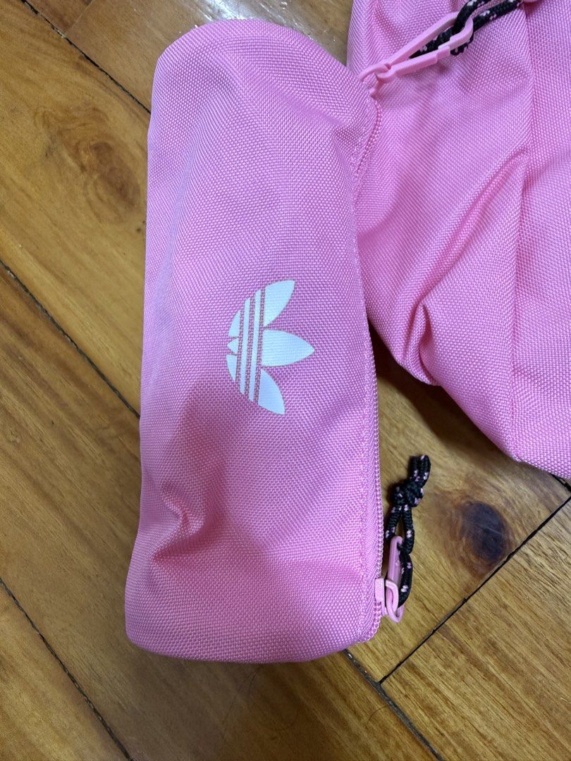 Authentic Adidas BACKPACK WITH PENCIL CASE In Bliss Pink (Category: Backpacks) located in Manila. Submitted by a.c.shop (Listing ID 1468931158, Image 2). Description: Dimensions: 12.25 cm x 30 cm x 42 cm Volume: 18.72 L Main Material: 100% Polyester(100% Recycled) / Lining: 100% Polyester(100% Recycled) / Padding: 100% Polyethylene Zip closure Colour: Bliss Pink .