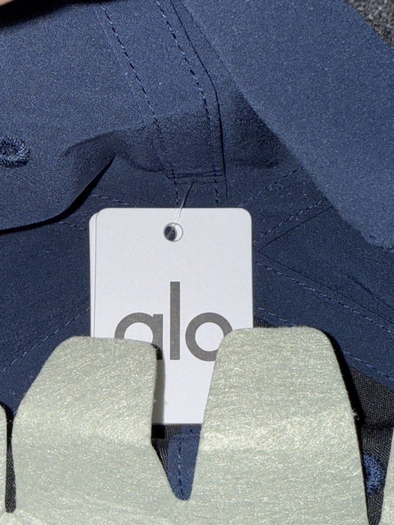 Authentic Alo Yoga Navy Hat Cap One Size (Category: Caps & Hats) located in Manila. Submitted by bl0ss0ms711 (Listing ID 1469117744, Image 3). Description: - Comes with its original paperbag and guaranteed authentic - Color: Navy / Navy - Performance Alo version is perfect for sports and more mobilisation movement activities - Design: Raised tonal logo on front - Fit: Adjustable strap, one size fits most - Condition: Brand new with original tags 