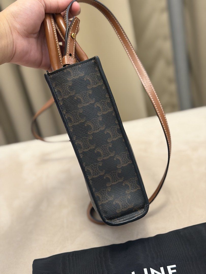 Authentic Celine Mini Vertical Cabas in Triomphe Canvas (Category: Cross-body Bags) located in Manila. Submitted by maria_2326 (Listing ID 1468983259, Image 3). Description: 💯% Authentic | w/ dust bag only Fits iphone promax Location: Manila/QC.