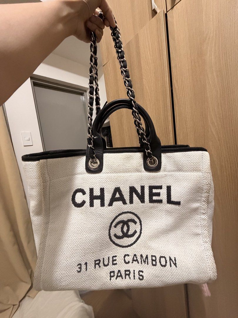 authentic chanel 31 rue cambon (Category: Tote Bags) located in Quezon City. Submitted by silverhaired (Listing ID 1469050414, Image 1). Description: - Model: Chanel 31 rue cambon - Color: Black and White - Branding: Iconic Chanel logo and Rue Cambon Paris lettering on the front - Straps: Double leather top handles and intertwined chain-leather shoulder straps - Hardware: Silver-tone with engraved Chanel branding - Interior: Spacious everyday car