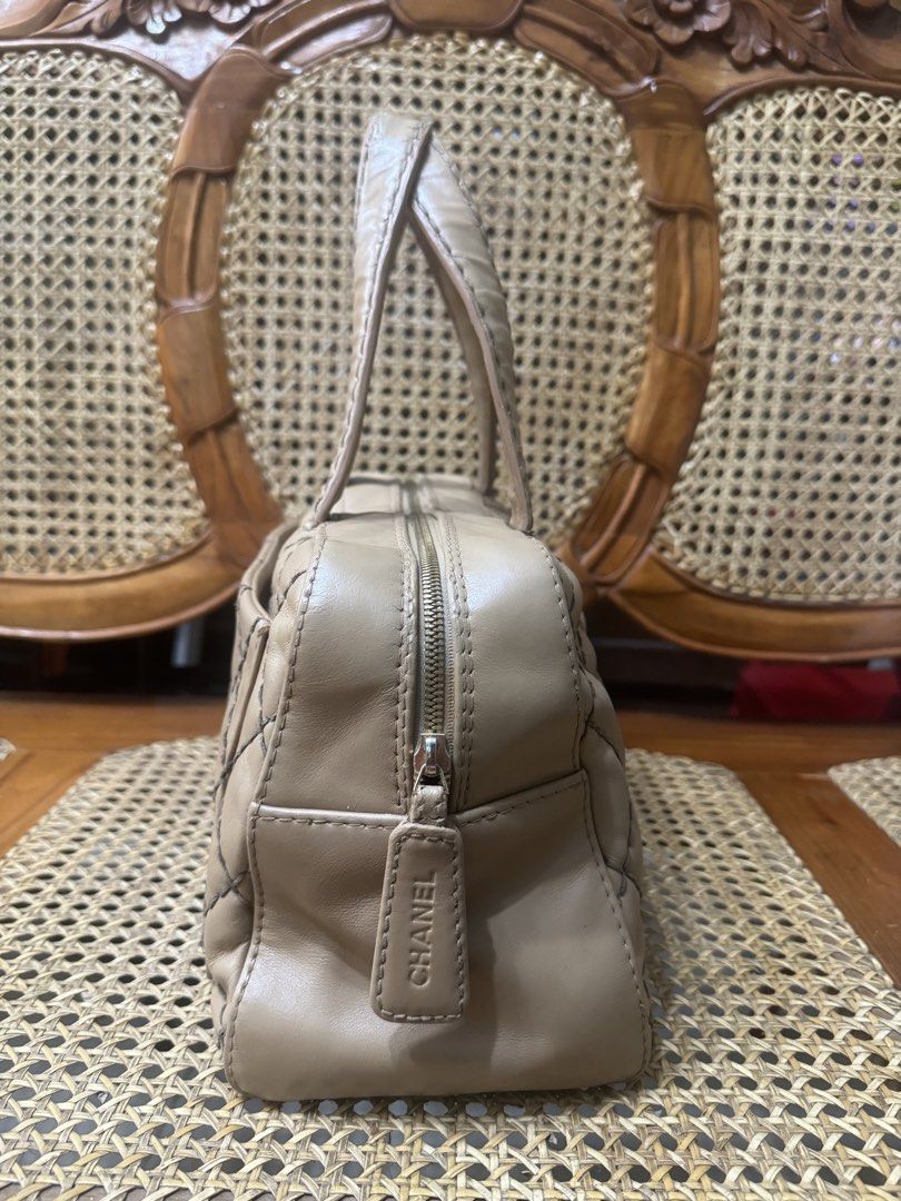 [AUTHENTIC] Chanel Wild Stitch Bowling Bag (Category: Luxury Bags & Wallets) located in Santa Rosa. Submitted by rjaarmblo (Listing ID 1468930307, Image 2). Description: - Beige Chanel handbag - Classic diamond quilting - Prominent black CC logo on the front - Secure zipper closure with branded tag - Comfortable leather handles - Ideal for everyday use - Adds a stylish touch to any outfit -Color enhanced already; but holo intact -As is where is; 