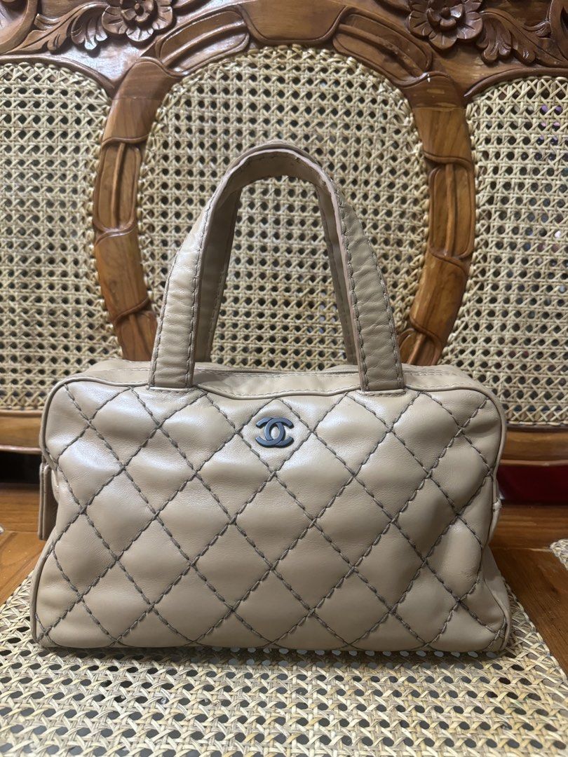 [AUTHENTIC] Chanel Wild Stitch Bowling Bag (Category: Luxury Bags & Wallets) located in Santa Rosa. Submitted by rjaarmblo (Listing ID 1468930307, Image 1). Description: - Beige Chanel handbag - Classic diamond quilting - Prominent black CC logo on the front - Secure zipper closure with branded tag - Comfortable leather handles - Ideal for everyday use - Adds a stylish touch to any outfit -Color enhanced already; but holo intact -As is where is; 