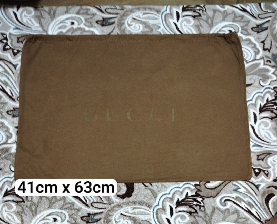 Authentic GUCCI dust bag dustbag (Category: Luxury Bags & Wallets) located in Zamboanga. Submitted by luxuryaccessories_ella.2022 (Listing ID 1469079596, Image 1). Description: Authentic 👉sized by cm ( centimeters) 👉 already wash 👉add sf 👉Loc po is Mindanao 👉 shipping thru J &T add 89 sa sf 👉MOP:Gcash or BPI.