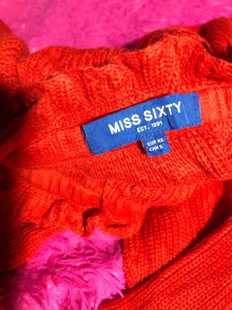 Authentic MISS SIXTY red knit off-shoulder (Category: Coats, Jackets and Outerwear) located in Cabuyao City. Submitted by ynasclowset (Listing ID 1469095104, Image 3). Description: Miss Sixty knit off-shoulder cropped sweater with long sleeves and branded tie-string details. message me for more details..