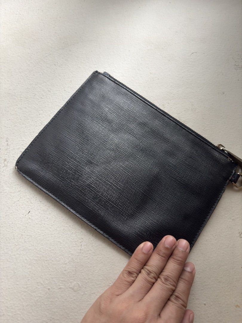 Authentic Moschino Teddy Bear Flat Clutch with Wristlet (Category: Luxury Bags & Wallets) located in Mandaluyong City. Submitted by wear_your_style (Listing ID 1468967946, Image 3). Description: Super nice. This the Couture line of Moschino, the most expensive line. Material is PU or PVC. Malambot naman siya. Inside lining is cloth with 1 zipped secret pocket. Black pa naman. The Teddy Bear is painted on the surface. Approx 9 inches wide and 7.5 