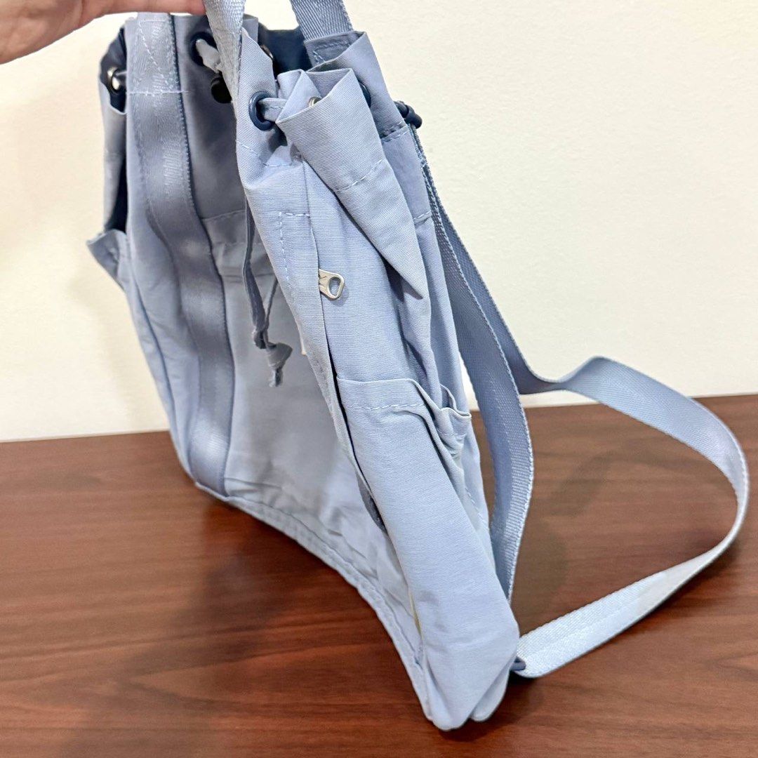 [Authentic] Used Rootote Drawstring Backpack Light Blue Nylon Tote Bag Convertible Utility Tool (Category: Backpacks) located in Quezon City. Submitted by brandedusagoodies (Listing ID 1469116760, Image 3). Description: Used Rootote utility tool drawstring bag in light blue nylon. Converts between a backpack and a tote, with top handles, adjustable backpack straps, a drawstring top with snap tabs, a front pocket and side pockets. Lightweight and 
