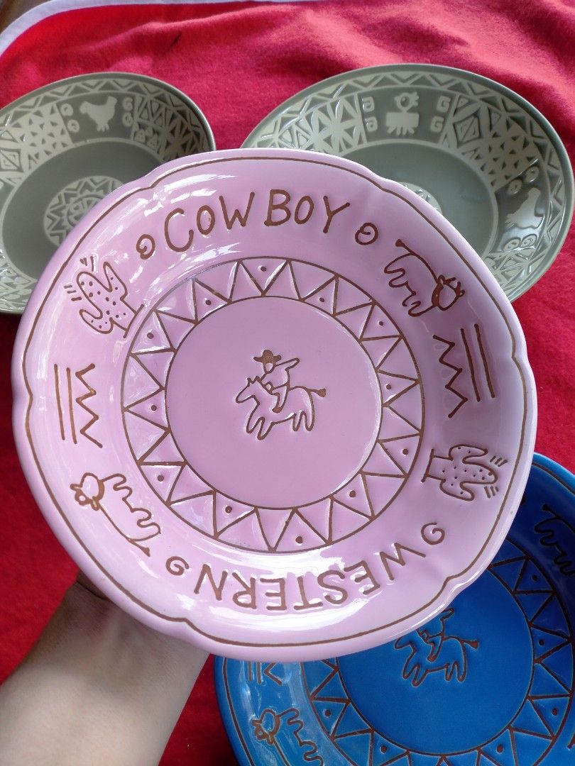 Aztec and Cowboy design 180 each (Category: Dinnerware & Cutlery) located in Manila. Submitted by margeventa (Listing ID 1468983969, Image 3). Description: - Set of 5 stoneware pieces: 3 colorful plates with cowboy graphics and scalloped edges (blue, light green, pink) plus 2 grey patterned bowls - Distinct western and aztec patterns add a unique rustic charm - Versatile use: great for daily dining or as home display decor - Perfect housewarming 