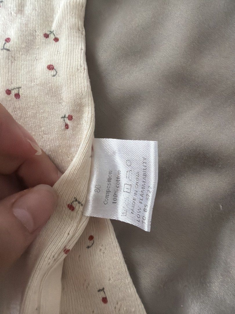 Baby Cherry Print Pyjamas Set Size 80 (Category: Babies & Kids Fashion) located in Manila. Submitted by 17thfinds (Listing ID 1468965148, Image 2). Description: - Size: 80 (Tag attached) - Material: 100% pure cotton for maximum comfort - Design: Cream-coloured with all-over sweet cherry print - Set includes: 1 short-sleeve top and 1 long pants - Cute details: Small red ribbon at the neckline and trendy red lettuce edge trimming on cuffs, hems, an