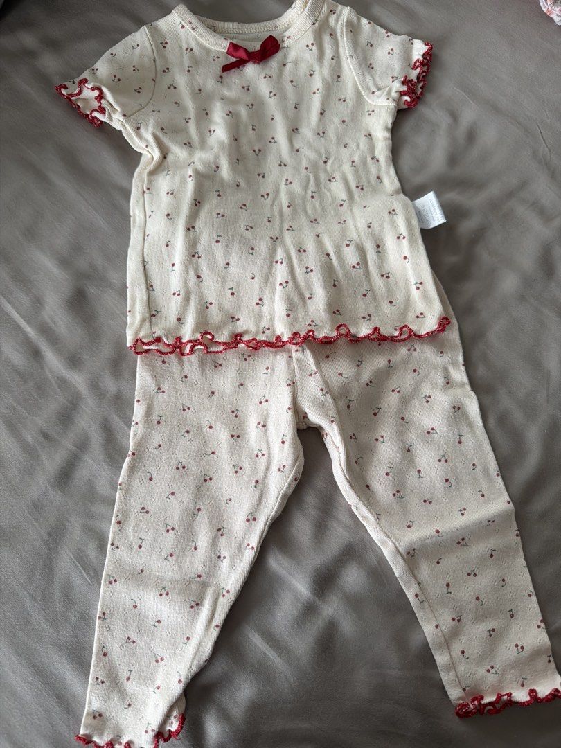 Baby Cherry Print Pyjamas Set Size 80 (Category: Babies & Kids Fashion) located in Manila. Submitted by 17thfinds (Listing ID 1468965148, Image 1). Description: - Size: 80 (Tag attached) - Material: 100% pure cotton for maximum comfort - Design: Cream-coloured with all-over sweet cherry print - Set includes: 1 short-sleeve top and 1 long pants - Cute details: Small red ribbon at the neckline and trendy red lettuce edge trimming on cuffs, hems, an