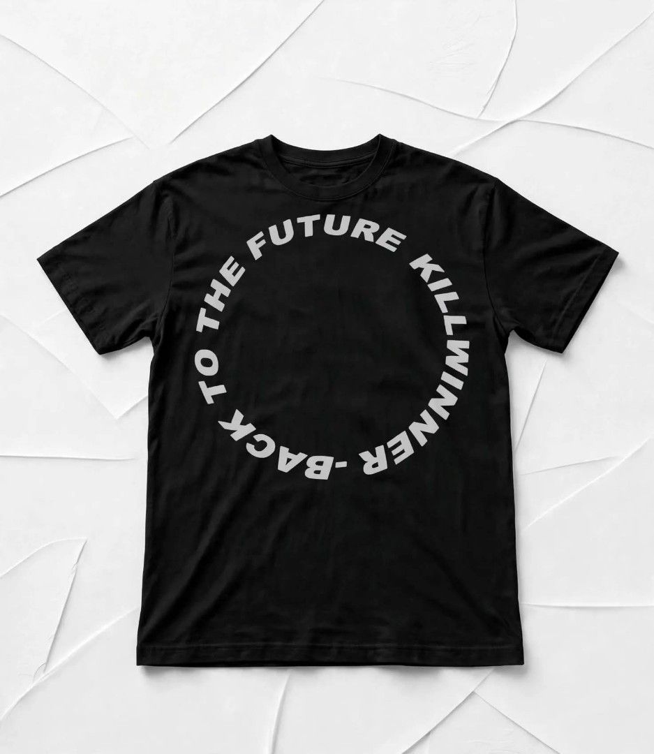 Back To The Future Black Graphic Tee I Tshirt (Category: Tshirts & Polo Shirts ) located in Aguinaldo. Submitted by ukayandthrift (Listing ID 1468931300, Image 2). Description: - Color: Solid Black - Material: Premium Cotton - Design: White typographic chest print (Back to the Future / Killwinner theme) - Neckline: Standard crew neck - Sleeve: Short sleeve - Style: Clean, minimal, and streetwear-ready.