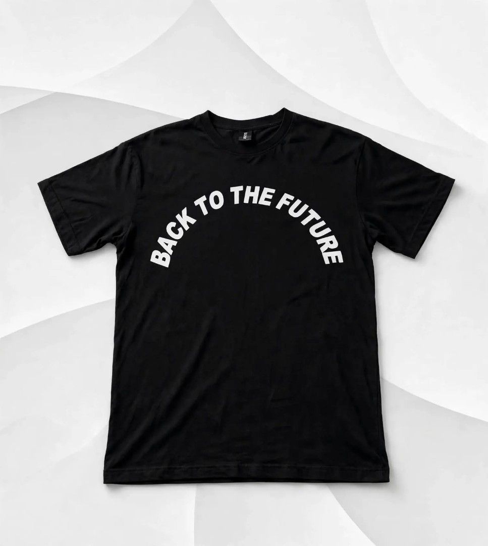 Back To The Future Black Graphic Tee I Tshirt (Category: Tshirts & Polo Shirts ) located in Aguinaldo. Submitted by ukayandthrift (Listing ID 1468931300, Image 1). Description: - Color: Solid Black - Material: Premium Cotton - Design: White typographic chest print (Back to the Future / Killwinner theme) - Neckline: Standard crew neck - Sleeve: Short sleeve - Style: Clean, minimal, and streetwear-ready.