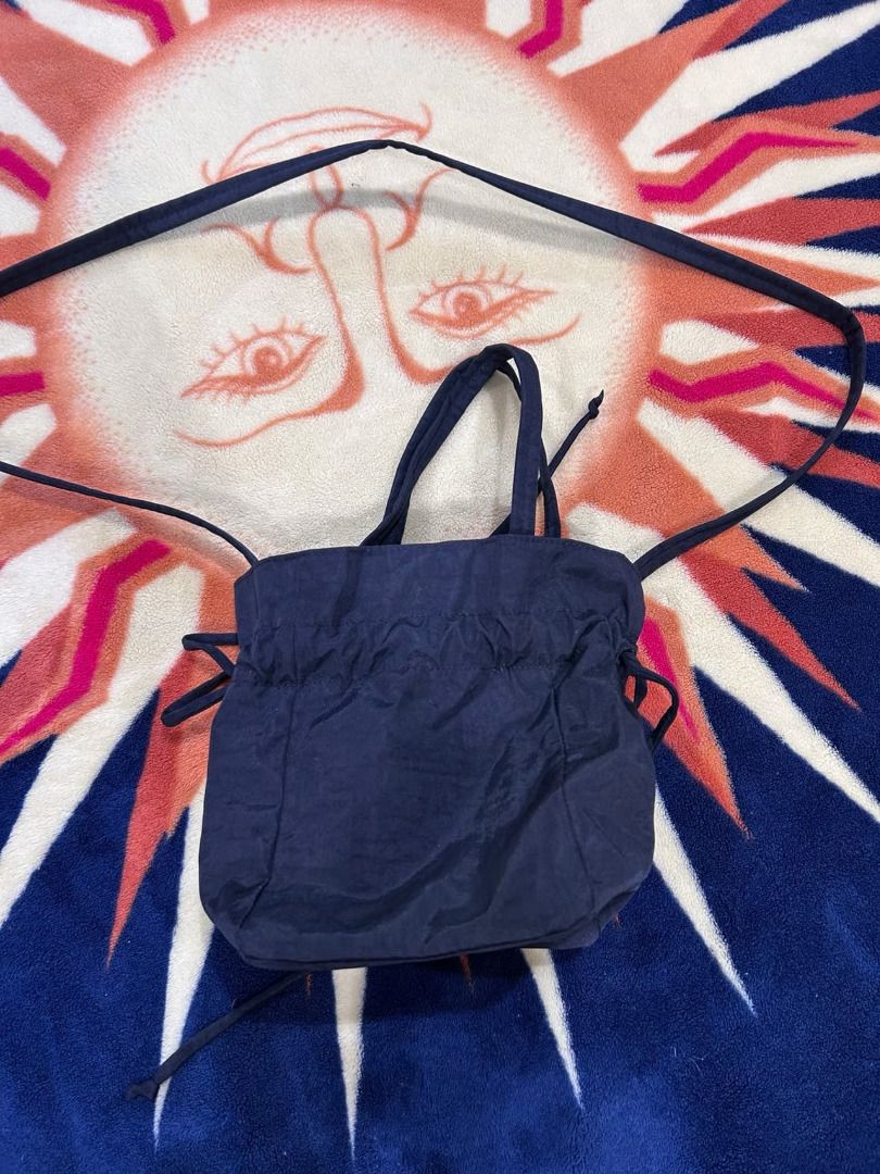 [free sf] BAGGU Nylon Drawstring Bag - Black (Category: Cross-body Bags) located in Mabalacat. Submitted by keb-a (Listing ID 1469062686, Image 3). Description: 🍒 — Measures 8.6" H x 5.5" W x 5.5" L — 39” strap & two 17.7” (7.5” drop length) top handles — Interior zip pocket — Recycled heavyweight nylon, recycled ripstop nylon lining — Machine washable — Can be worn as a crossbody bag or top-handle bag 🍒 — Authentic, purchased from Certified Ca