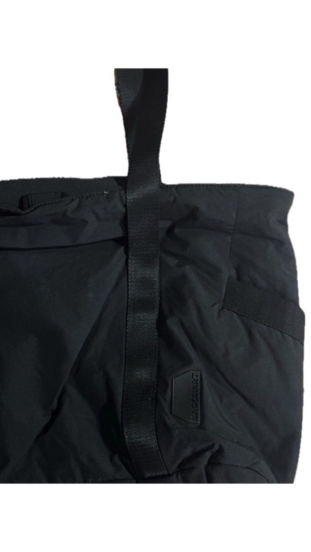 BAGSMART Black Tote Bag (Category: Tote Bags) located in Malabon City. Submitted by imjustagirl_ (Listing ID 1469043578, Image 3). Description: - Brand: BAGSMART - Color: Classic Black - Material: Durable nylon - Straps: Sturdy and comfortable for daily wear - Organization: Multiple exterior pockets on the sides and back - Details: Features BAGSMART logo patch near the bottom right - Condition: Clean interior and exterior, well-maintained.