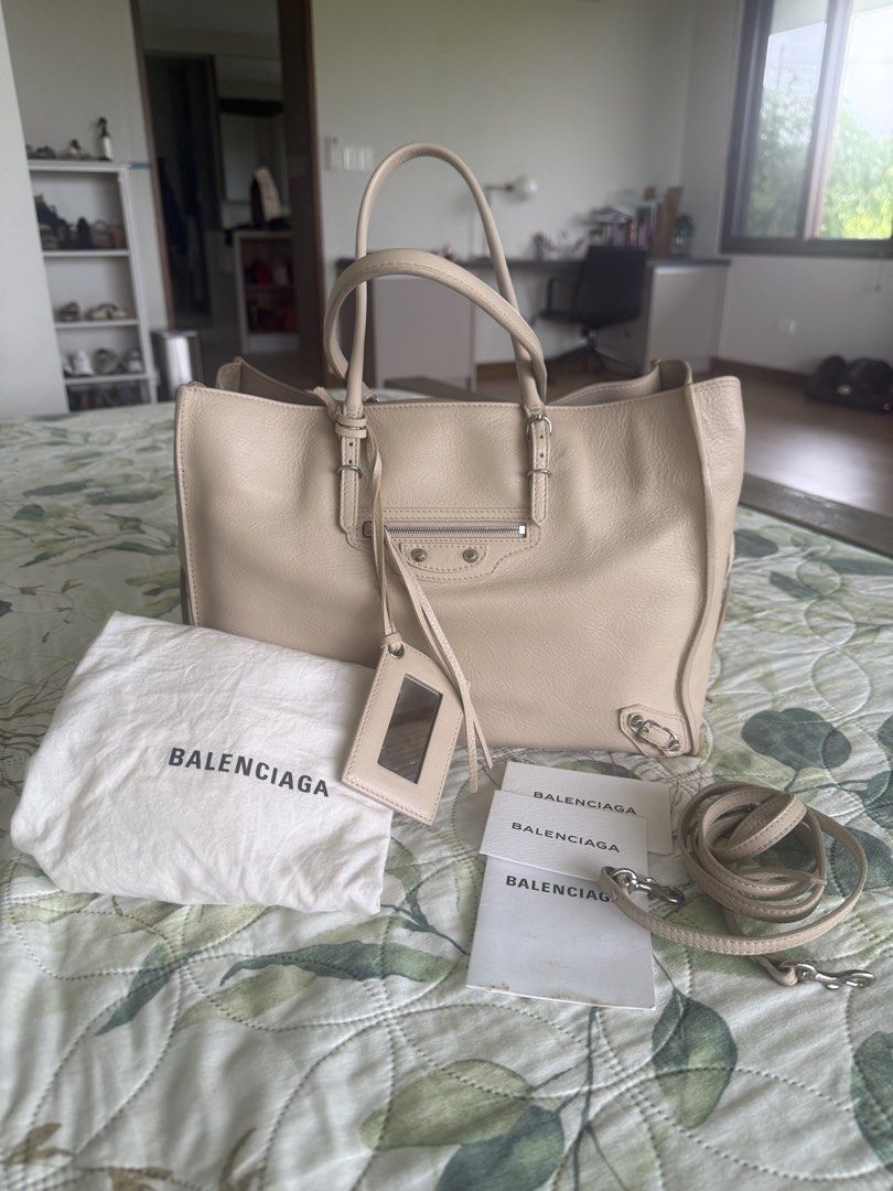 Balenciaga in Neutral Beige (Category: Luxury Bags & Wallets) located in Calamba. Submitted by mom2girls (Listing ID 1468931343, Image 1). Description: A very classy and decent bag. Can go with any outfit. Please note the minor scratch at the bottom of the bag and the ink stain inside the bag as shown in the photos. Threw away that pen since then. Shipping via LBC Nuvali only. SF c/o Buyer. .