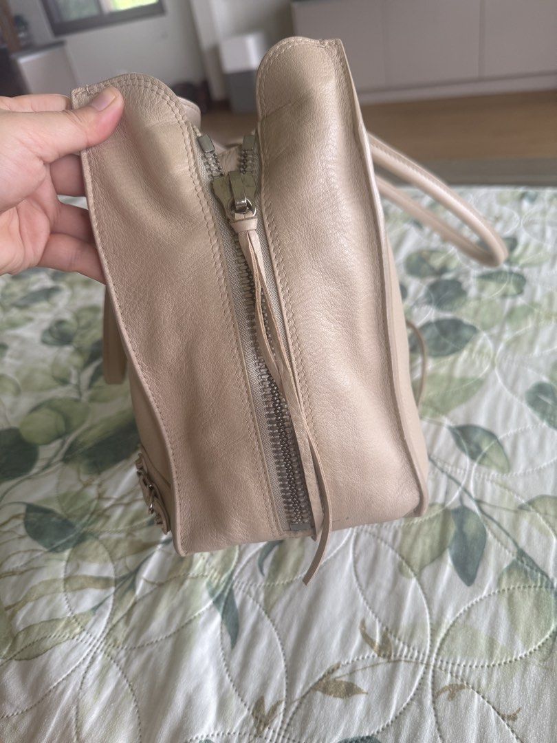 Balenciaga in Neutral Beige (Category: Luxury Bags & Wallets) located in Calamba. Submitted by mom2girls (Listing ID 1468931343, Image 3). Description: A very classy and decent bag. Can go with any outfit. Please note the minor scratch at the bottom of the bag and the ink stain inside the bag as shown in the photos. Threw away that pen since then. Shipping via LBC Nuvali only. SF c/o Buyer. .