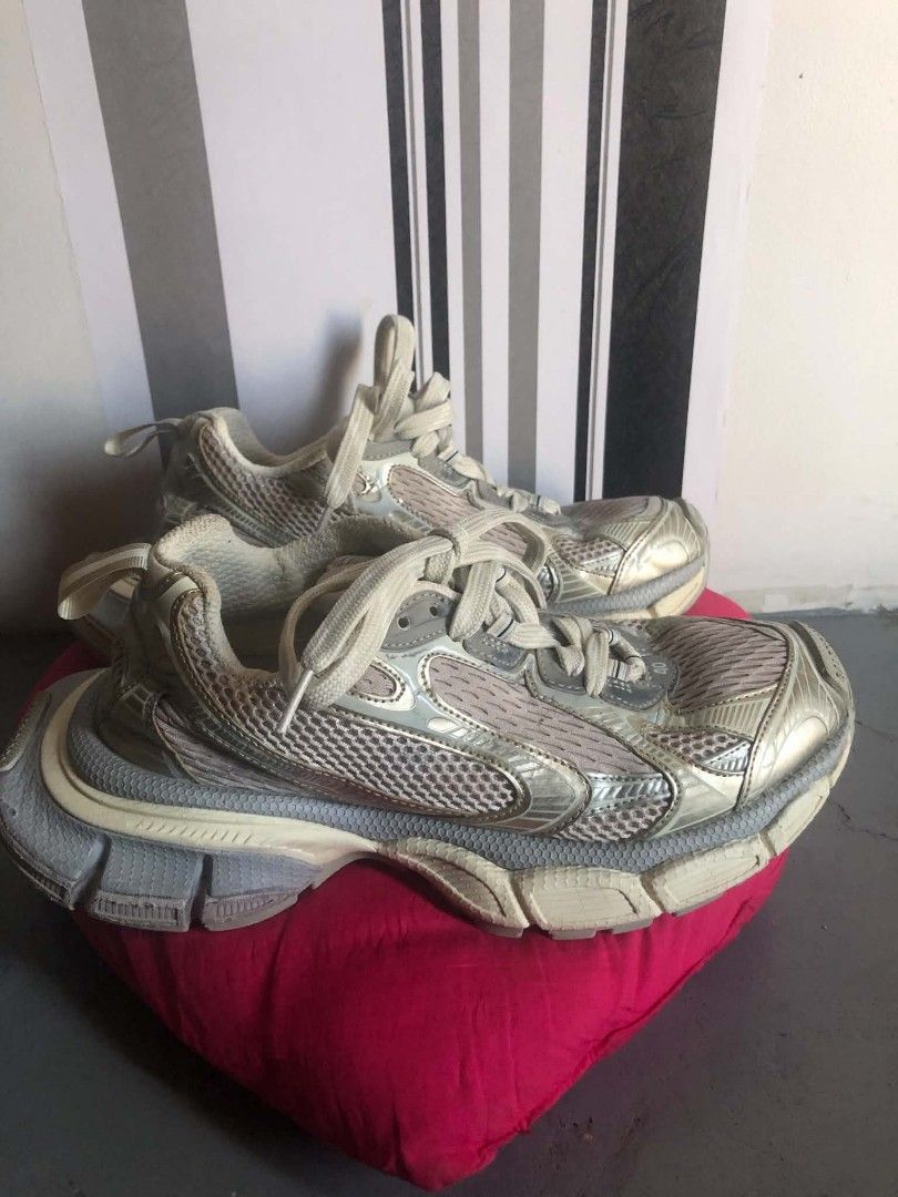 Balenciaga Runner Sneakers Metallic Silver Size 40 (Category: Sneakers) located in Manila. Submitted by wonderboi80 (Listing ID 1468982891, Image 2). Description: - Brand: Balenciaga - Model: Runner Sneakers - Colorway: Silver and Off-White - Size: 40 (marked on toe and tongue) - Design: Chunky layered sole with mesh and metallic panels, Balenciaga logo on front bumper - Closure: Lace-up with thick round laces - Condition: Pre-owned with visible 