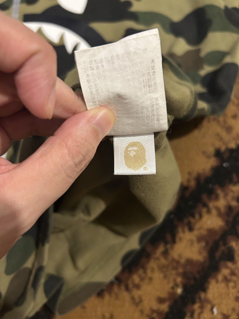 Bape Shark 1st camo tee (M) (Category: Tshirts & Polo Shirts ) located in Manila. Submitted by live.love.garments (Listing ID 1469157019, Image 3). Description: size medium 23.5x27 authentic 9.5/10 color rate minor flaw only sa wgm print.