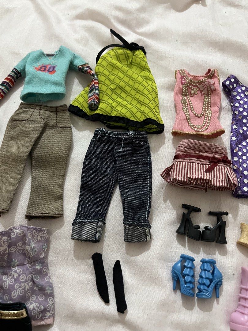 Barbie Clothes Bundle Model Muse (Category: Kids Toys) located in Manila. Submitted by lovedbyjk (Listing ID 1469100673, Image 2). Description: Sold as Bundle Only- Discounted Price Already, Bought them individually totaling 3.5k but selling low RFS: Minimizing my model muse clothes due to changing my doll collection line. Focusing in Repros -Top Model Teresa (Top, Pants, Socks) -Red Mini snap button skirt -Y2K tops -Fashion fever shoes -Bundles 