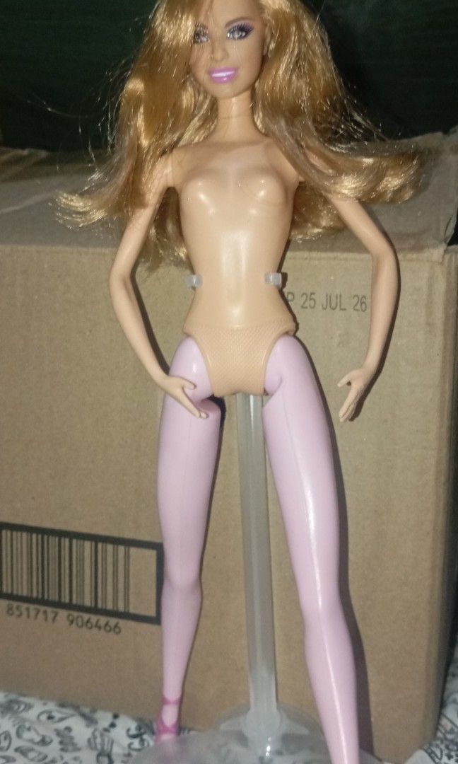 Barbie doll (Category: Figurines & Statues) located in Trece Martires City. Submitted by barbies_storeee-13 (Listing ID 1469084059, Image 1). Description: they say she is fashionista I rebodied her and she has bite marks and her hair is kinda curly it's also smooth.