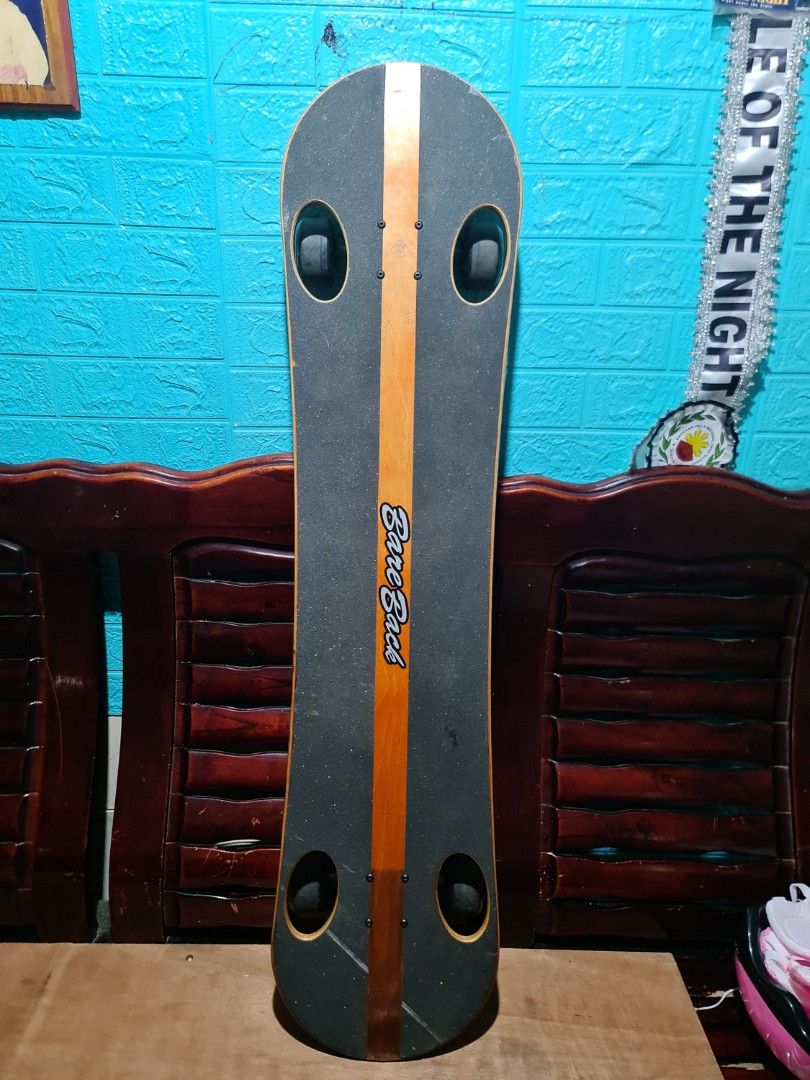Bare Back Skateboard with Green Wheels (Category: Skates, Rollerblades & Scooters) located in San Mateo. Submitted by gk2900504184839 (Listing ID 1468936498, Image 1). Description: - Brand: Bare Back complete skateboard (ready to ride) - Deck: Wooden deck with center wood stripe and black grip tape on top - Design: Blue graphic logo on a natural wood finish bottom - Hardware: Green wheels with black hubs and stylish purple bushings - Condition: M