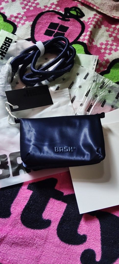 BASH Alps Mini Cache Wallet in Twilight (Category: Wallets & Card holders) located in Manila. Submitted by roserallos42594 (Listing ID 1469065600, Image 2). Description: - Brand: BASH Alps Mini Cache Wallet - Color: Twilight - Condition: Brand new in frosted zip bag - Inclusions: Original packaging, tags, and matching neck lanyard - Design: Zipper pouch style with debossed brand logo on the front.