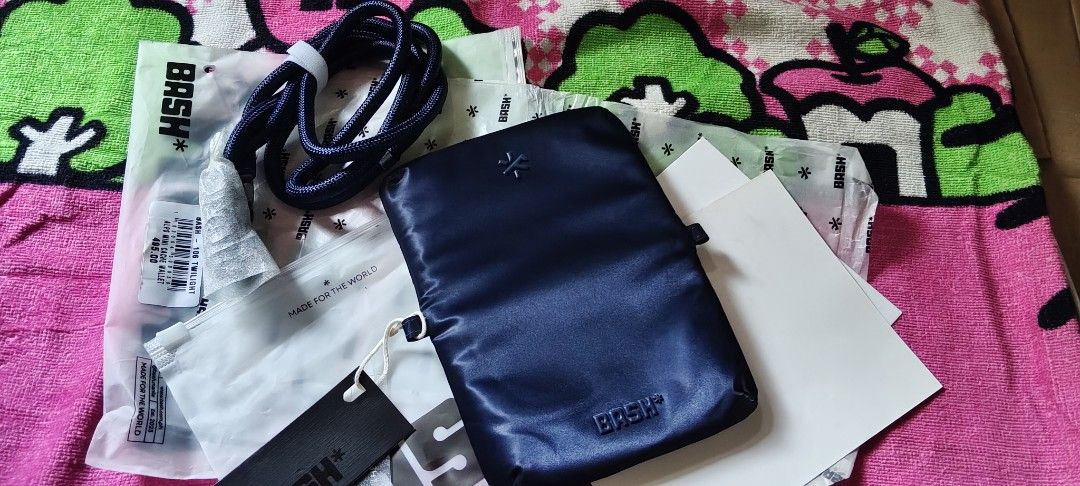 BASH Alps Mini Cache Wallet in Twilight (Category: Wallets & Card holders) located in Manila. Submitted by roserallos42594 (Listing ID 1469065600, Image 1). Description: - Brand: BASH Alps Mini Cache Wallet - Color: Twilight - Condition: Brand new in frosted zip bag - Inclusions: Original packaging, tags, and matching neck lanyard - Design: Zipper pouch style with debossed brand logo on the front.
