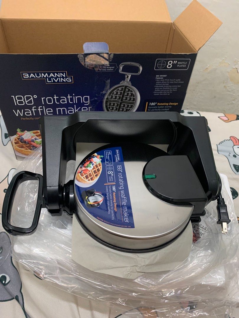 Baumann Living 180° Rotating Waffle Maker BM-SW2087 (Category: Cookware & Accessories) located in Taguig. Submitted by jeffreydelara1999 (Listing ID 1469073457, Image 3). Description: - Brand: Baumann Living - Model: BM-SW2087 (180° Rotating Waffle Maker) - Condition: Brand new, unused, still in original plastic wrappers and styrofoam - Plate Size: 8-inch non-stick, PFOA-free coating for easy release and cleanup - Features: Adjustable browning co
