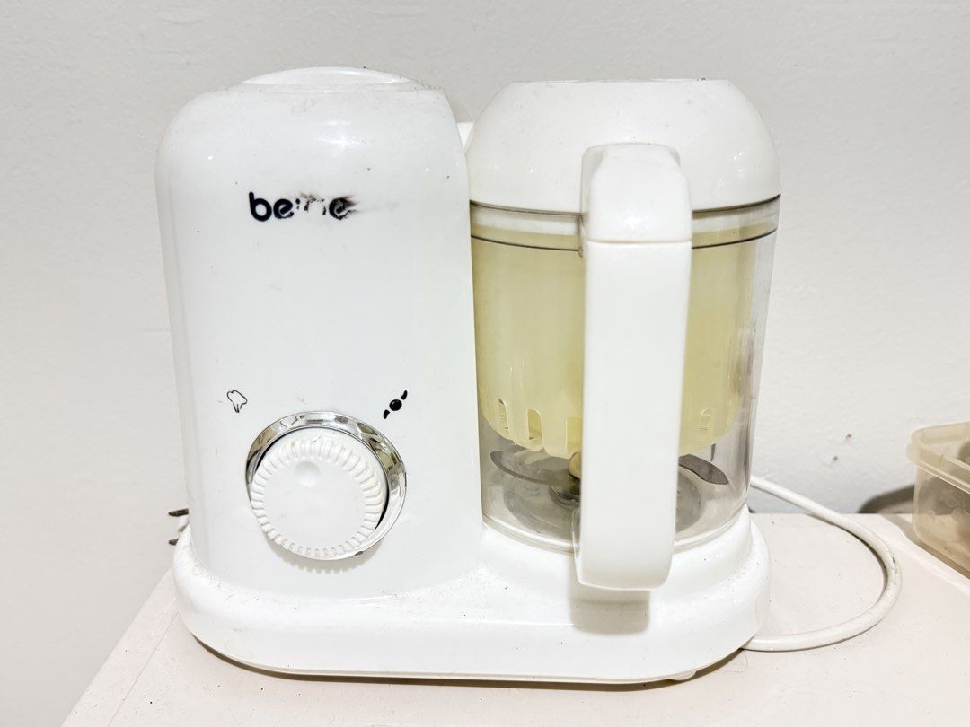 Beige Baby Food Maker (Category: Weaning & Toddler Feeding) located in Manila. Submitted by happyturtle.09 (Listing ID 1469045870, Image 1). Description: - Authentic beige baby food maker (White) - Includes main motor base with control dial, blending jug with stainless steel blade, and steaming basket - Powers on via attached power cable - Pre-loved condition with slight wear and minor marks from normal kitchen use - Ideal for easily steaming and