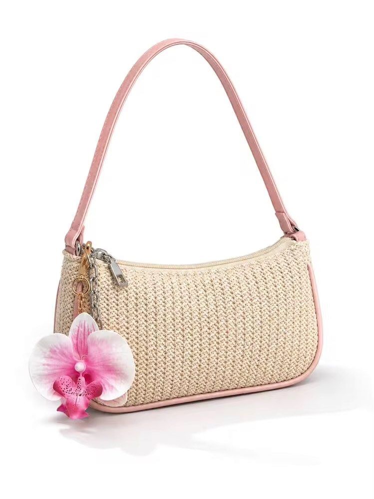 beach summer woven bag with pink strap (Category: Shoulder Bags) located in Quezon City. Submitted by kalmai (Listing ID 1469097103, Image 1). Description: orchid charm not included! - Material: Woven straw body with pastel pink leather-look trim - Closure: Secure top zipper - Strap: Matching pink shoulder strap - Color: Creamy beige with pastel pink accents - Occasion: Ideal for beach trips, sunny days, and brunch dates - Condition: Brand new / 