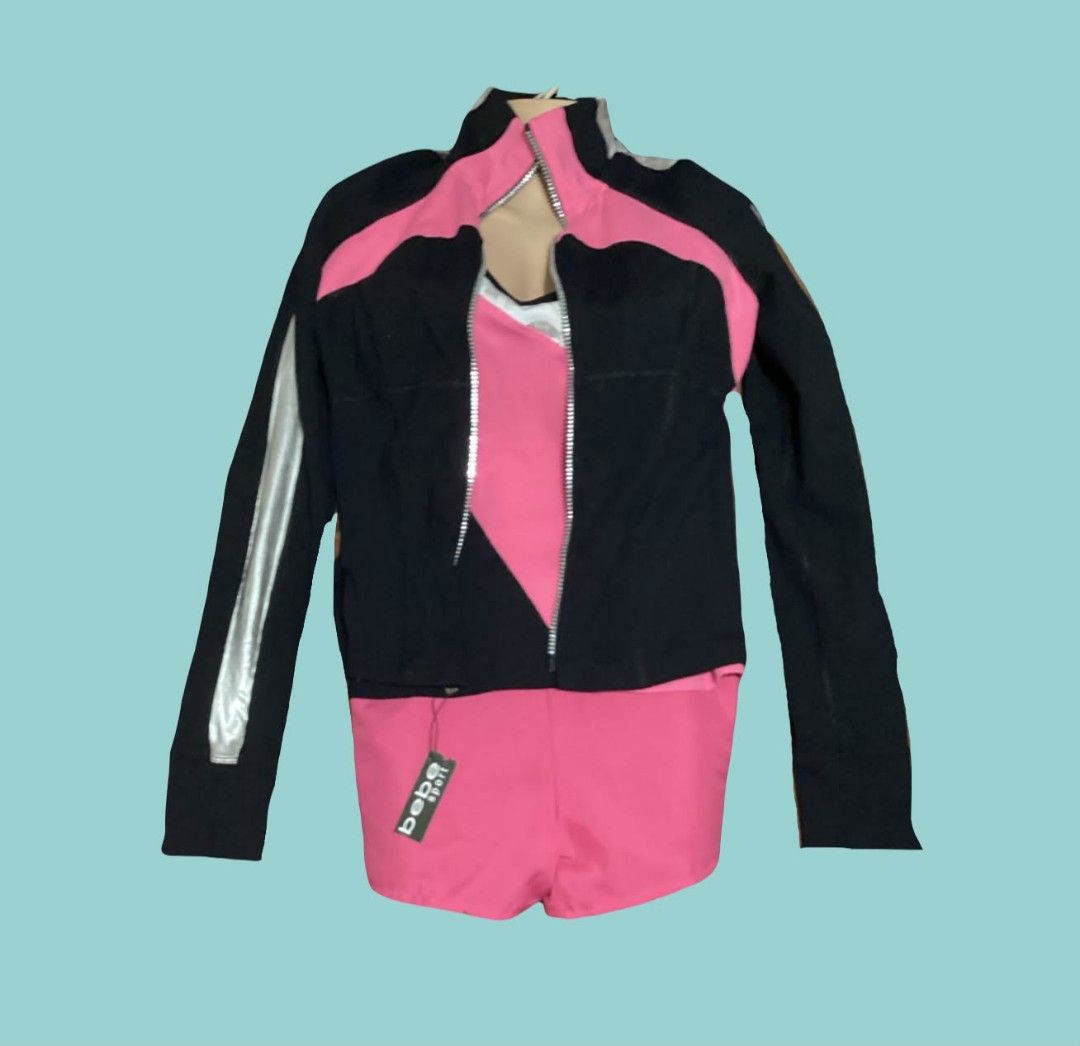Bebe Sport Black Pink Tracksuit Set (Category: Activewear) located in Paranaque City. Submitted by calm_youngstore7 (Listing ID 1468974177, Image 3). Description: - Brand: Bebe Sport - Color: Black and pink with silver and white accents - Set includes: Zip-up track jacket, matching tank top, and flared athletic pants - Condition: Brand new with tags (attached on pants) - Style: Great for workouts, gym sessions, or stylish casual athleisure - DM f