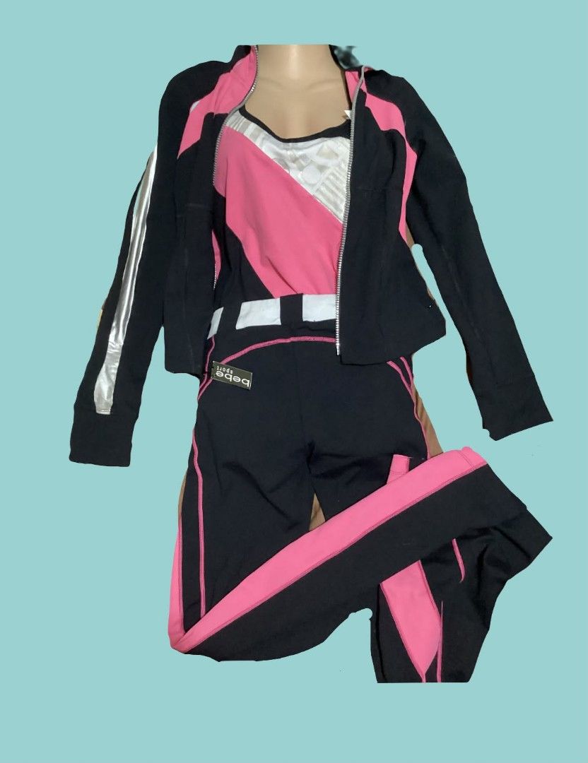 Bebe Sport Black Pink Tracksuit Set (Category: Activewear) located in Paranaque City. Submitted by calm_youngstore7 (Listing ID 1468974177, Image 2). Description: - Brand: Bebe Sport - Color: Black and pink with silver and white accents - Set includes: Zip-up track jacket, matching tank top, and flared athletic pants - Condition: Brand new with tags (attached on pants) - Style: Great for workouts, gym sessions, or stylish casual athleisure - DM f