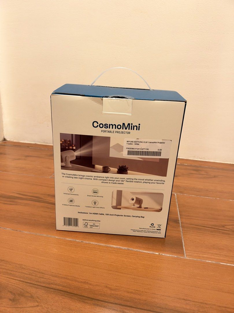 Before Anything Else CosmoMini Portable Projector (Category: Projectors) located in Manila. Submitted by brightstone_0013f2 (Listing ID 1469082455, Image 2). Description: - Model: CosmoMini Portable Projector (White) - Condition: Brand new, sealed in box - Design: Compact with 180-degree flexible rotation - Features: Cosmic ambience lighting & smart screen mirroring - Included Freebies: 1m HDMI cable, 100-inch projector screen, and carrying bag -