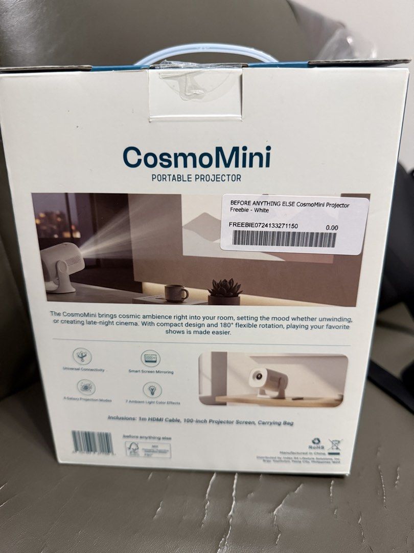 Before Anything Else CosmoMini Portable Projector White (Category: Projectors) located in Famy. Submitted by crossover14 (Listing ID 1469115964, Image 2). Description: - Brand: CosmoMini Portable Projector (White) - Condition: Brand new, sealed in box (unopened) - Design: Compact with 180-degree flexible rotation - Features: Smart screen mirroring & universal connectivity - Freebies included: 1m HDMI cable, 100-inch projector screen, and carrying