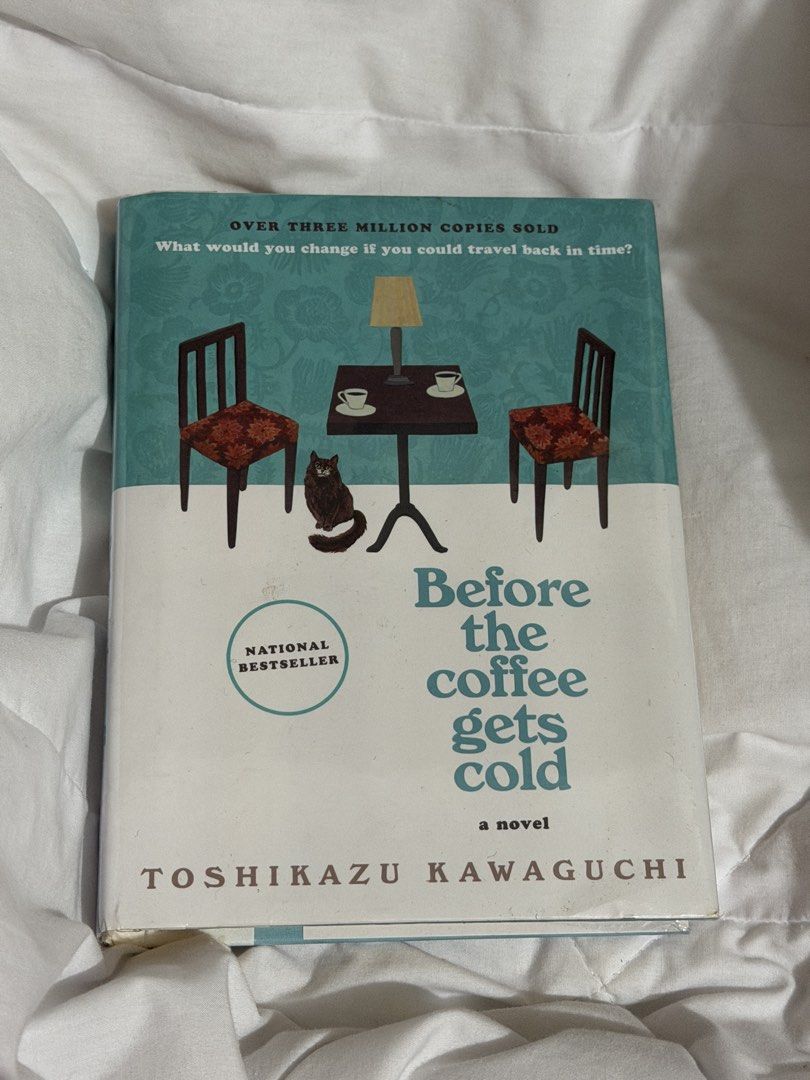 Before the Coffee Gets Cold - hardbound cover (Category: Storybooks) located in Makati City. Submitted by joyjoytee (Listing ID 1469062356, Image 1). Description: - Title: Before the Coffee Gets Cold - Author: Toshikazu Kawaguchi - Format: Hardcover - Language: English (Translated by Geoffrey Trousselot) - Condition: Read once, pages slightly yellowed around the edges, spine intact, no missing pages, original retail sticker on back cover - Genre: