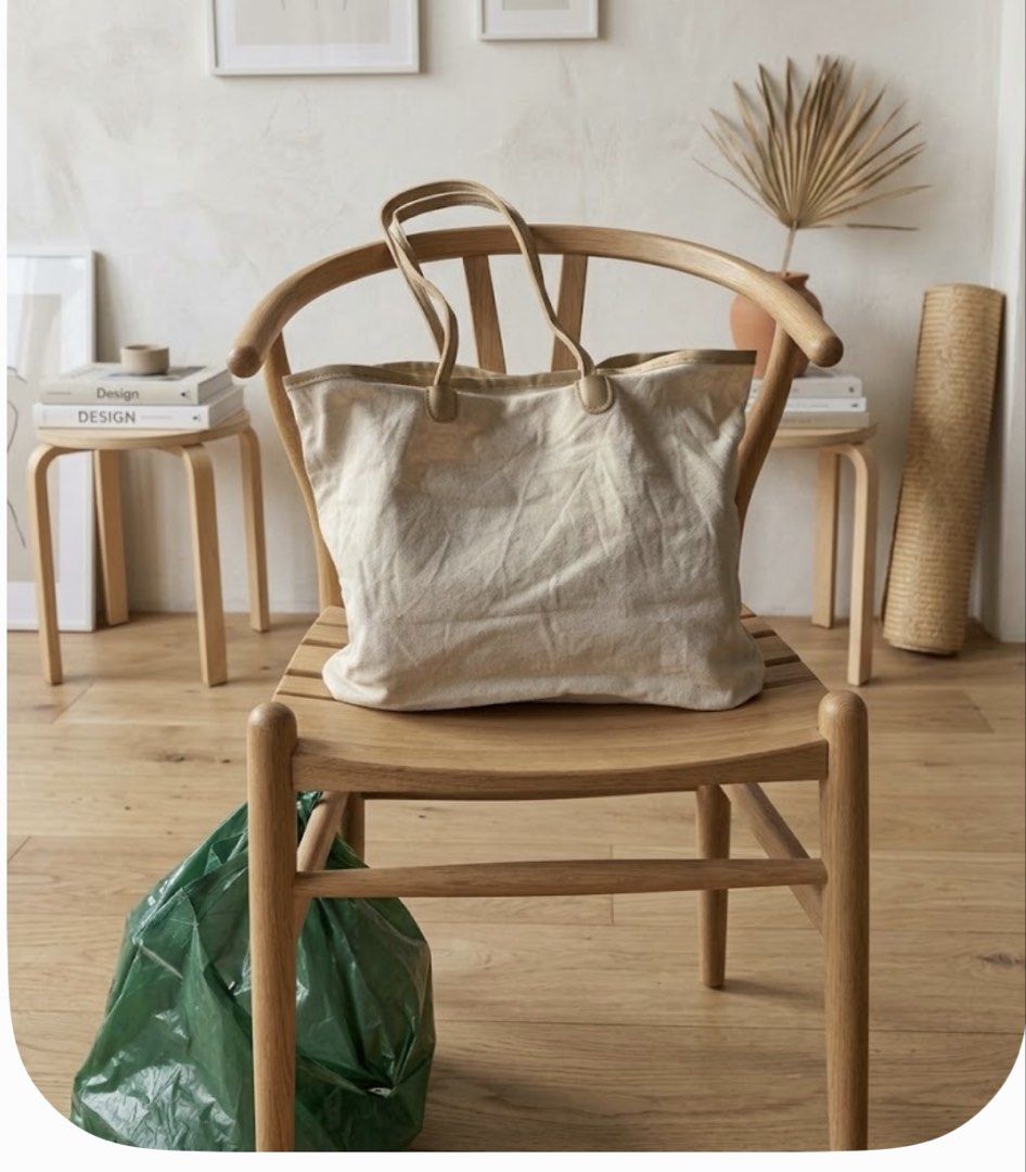 Beige Canvas Tote Bag with Leather Trim (Category: Tote Bags) located in Manila. Submitted by goldenphoenix_ac6904 (Listing ID 1468943948, Image 1). Description: - Color: Neutral beige/cream - Material: Canvas with leather trim - Closure: Top magnetic closure - Storage: Spacious main compartment with interior zippered pocket - Handles: Dual top handles for easy carrying - Condition: Some staining on the interior lining from previous use.