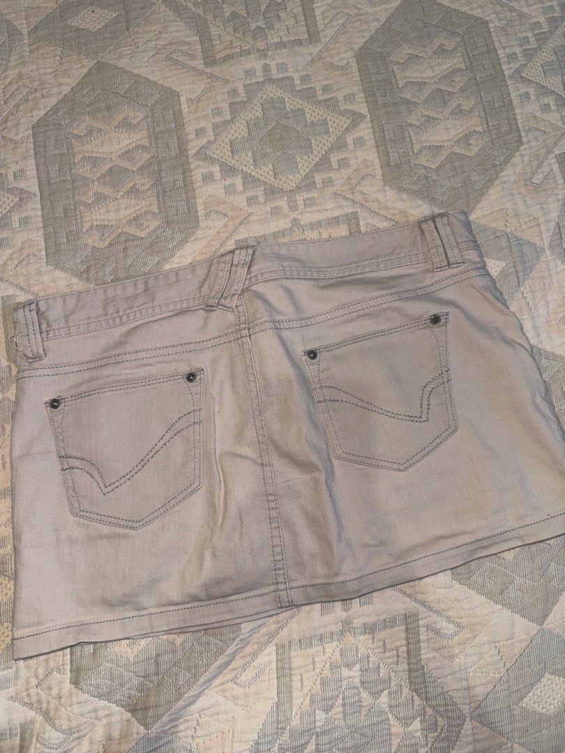 Beige Denim Skirt Size 8 (Category: Skirts) located in Manila. Submitted by andreaaarut2 (Listing ID 1469018359, Image 3). Description: RFS: Big on the waist for me :) Item is still in super great quality - Brand/Style: NET Ladies denim skirt - Color: Neutral beige - Size: 8 - Design: Classic five-pocket style with contrast stitching and belt loops - Details: Front button closure, back pockets with stitched V-design and metal rivets - Condition: 